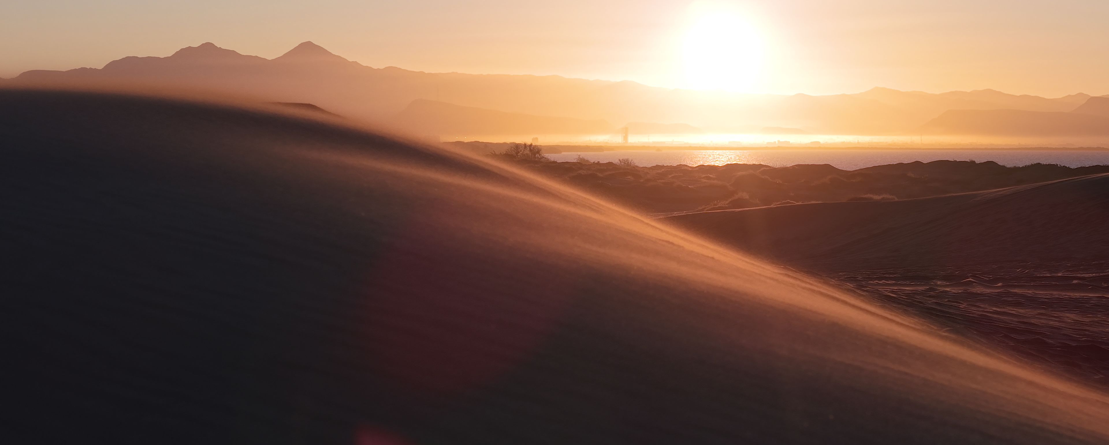 Sunrise over sand dune from drone