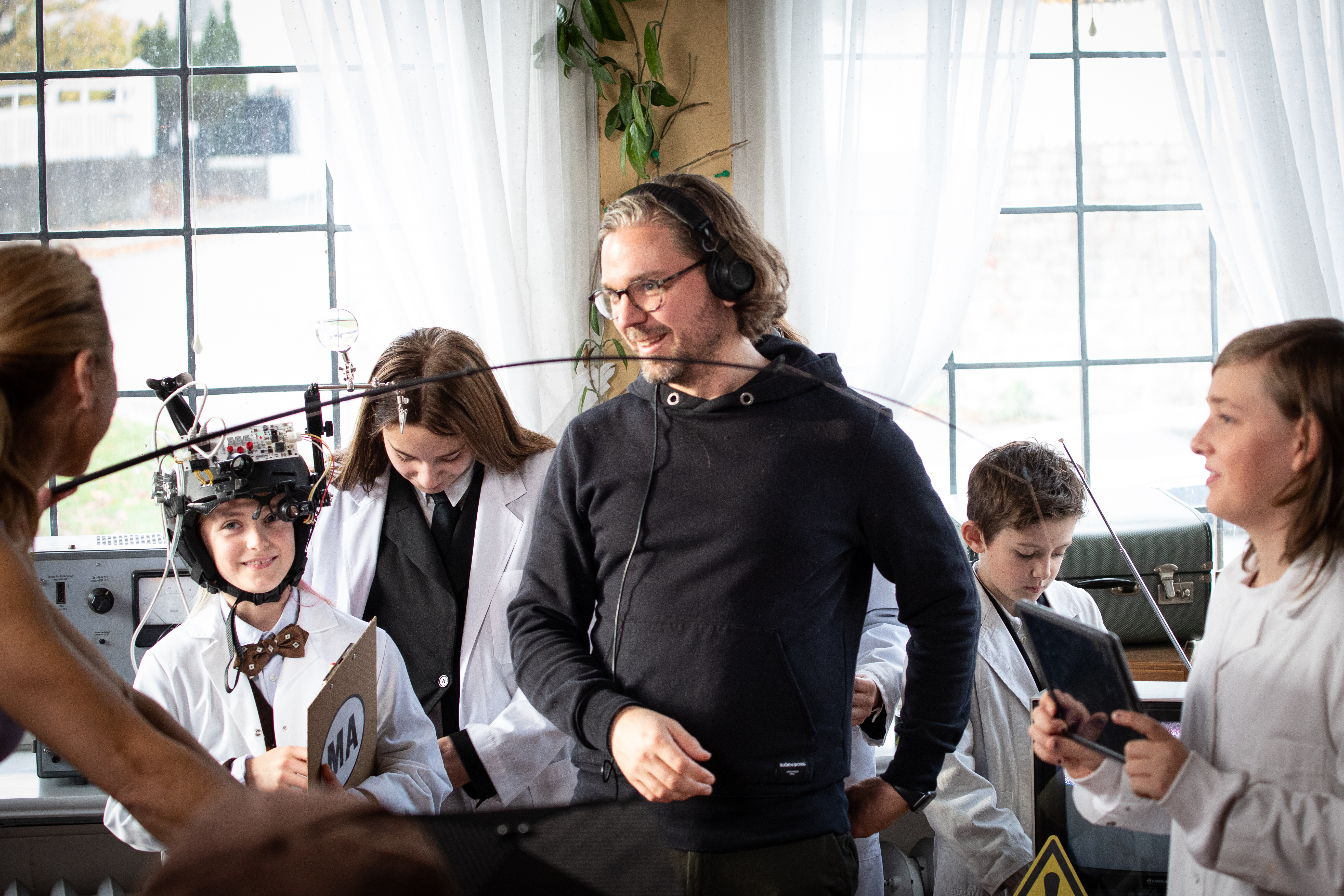 Ola Martin directing a set with children